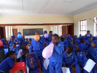 Learners using balloons to demonstrate Newton's Third Law 