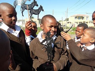 Learner's showing off their puppet making skills