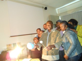 Eli Kasai demonstrating moon phases to educators