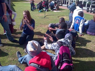 Voortrekker assistant giving a demonstration of pop rocket making