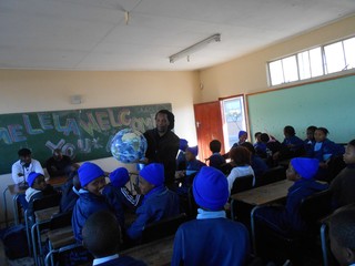 Sivuyile using the Earth Ball to explain astronomical concepts during his National Science Talk 